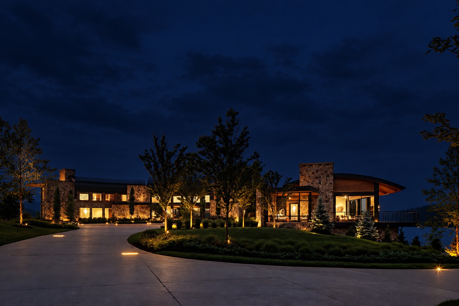 Lakefront residence with warm lighting at night